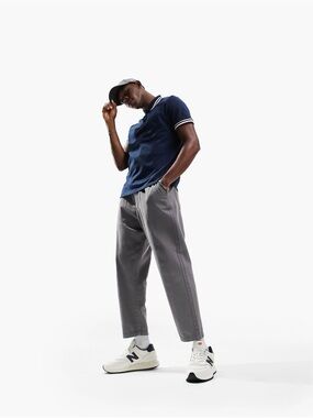 ASOS DESIGN tipped pique polo shirt in navy.